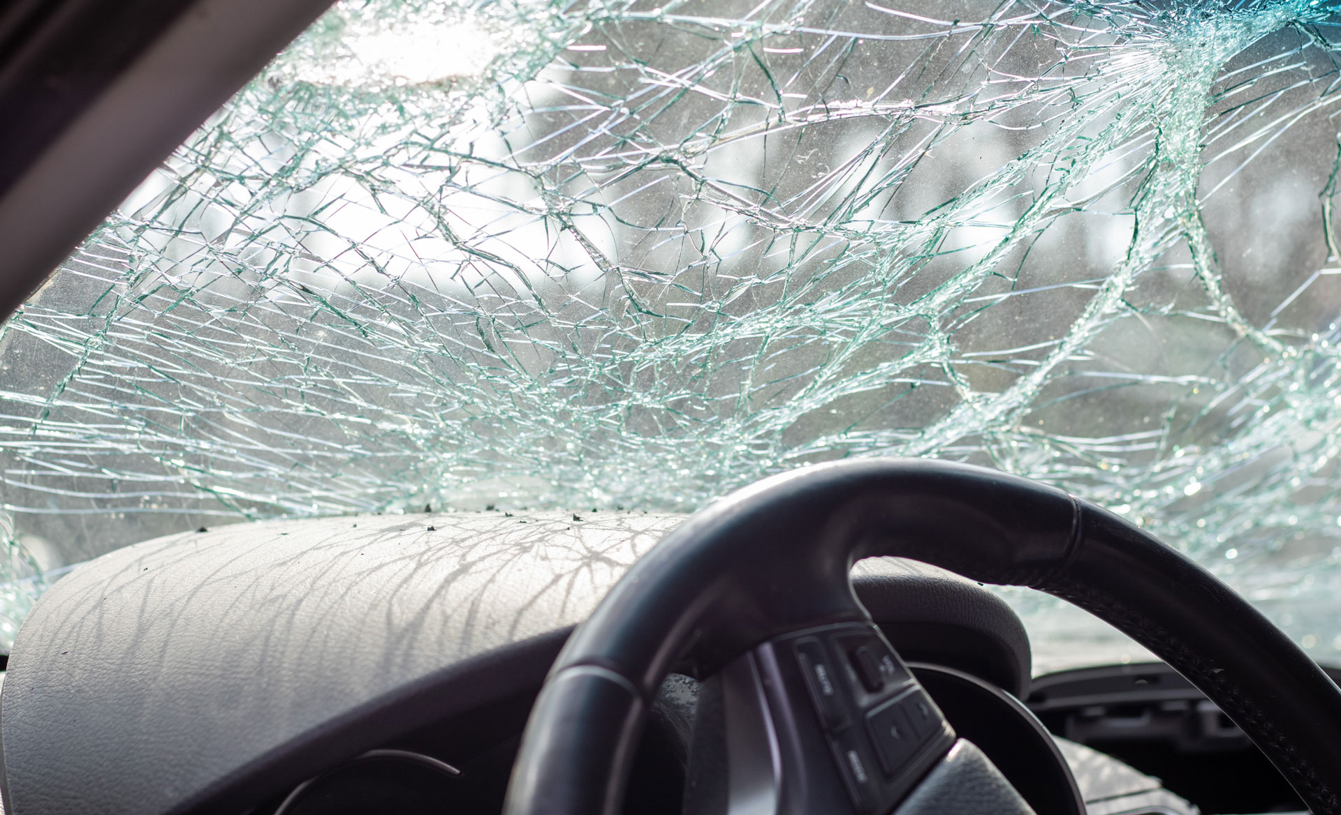 looking out from drivers seat through broken windshield